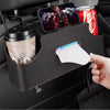 A black car back seat organizer holding a cup, a can, and a smartphone.