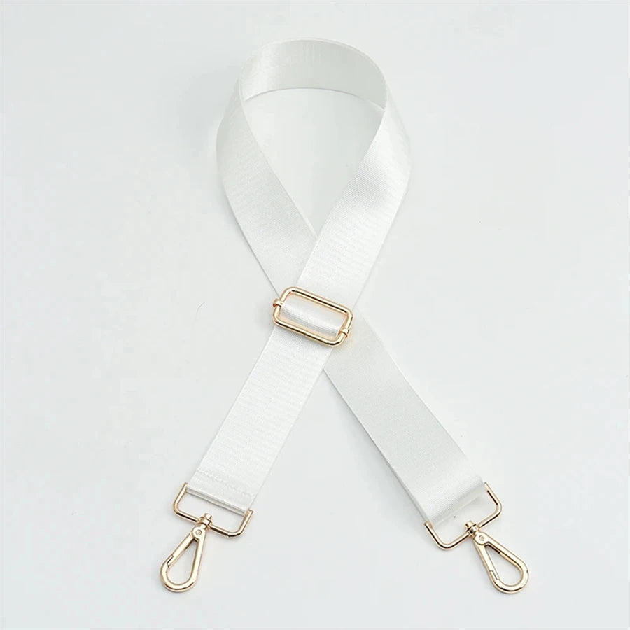 White nylon bag strap with a gold buckle shown diagonally against a white background.