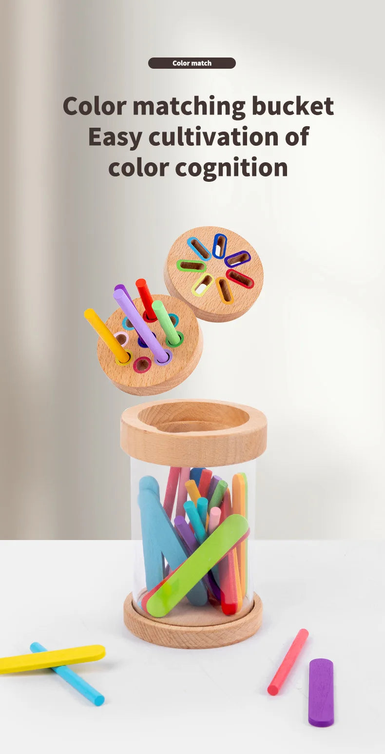A wooden color matching bucket filled with various colored sticks and crayons for a color sorting game.