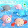 A set of colorful bath toys featuring cartoon turtles, ducks, and whales floating in water.