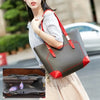 A woman holds a foldable oxford cloth makeup organizer bag with red accents and a strap, next to an open view of the interior