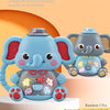 A light blue elephant musical piano toy with random parts, sitting on a white stand.