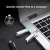 SanDisk Ultra Dual Drive Luxe USB 3.2 flash drive connected to a laptop for file transfer.