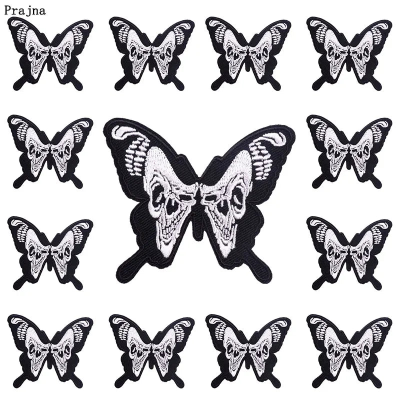 A set of ten black and white embroidered butterfly patches featuring skull designs for iron-on use.