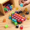 A collection of multicolor acrylic D6 dice in various colors and shapes are displayed on a wooden surface.