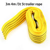 Yellow trailer rope coiled and laid out for vehicle recovery towing.