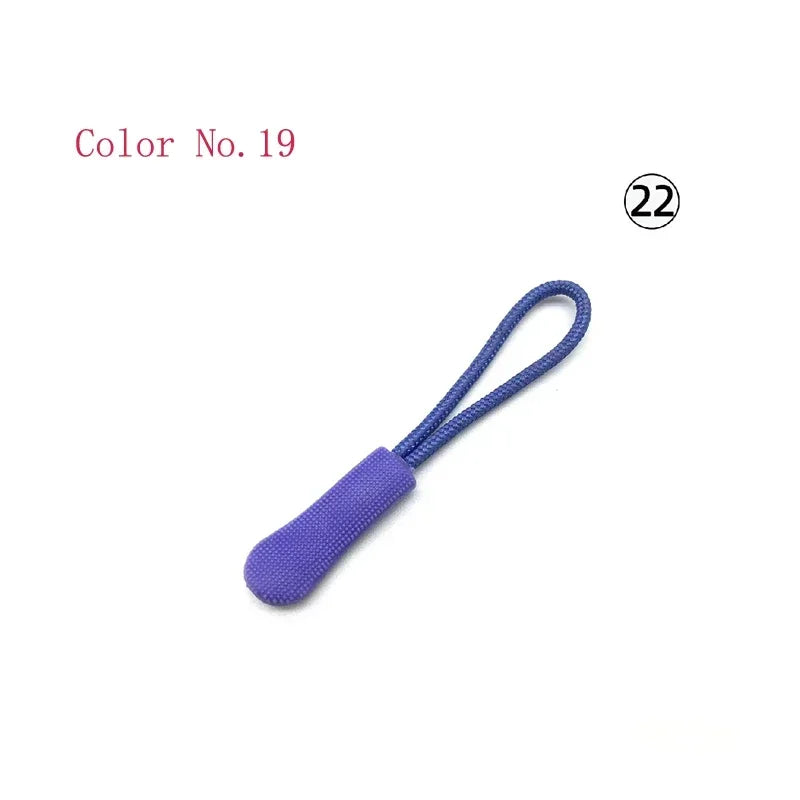 Purple plastic zipper pull with a string attached, labeled Color No. 19.