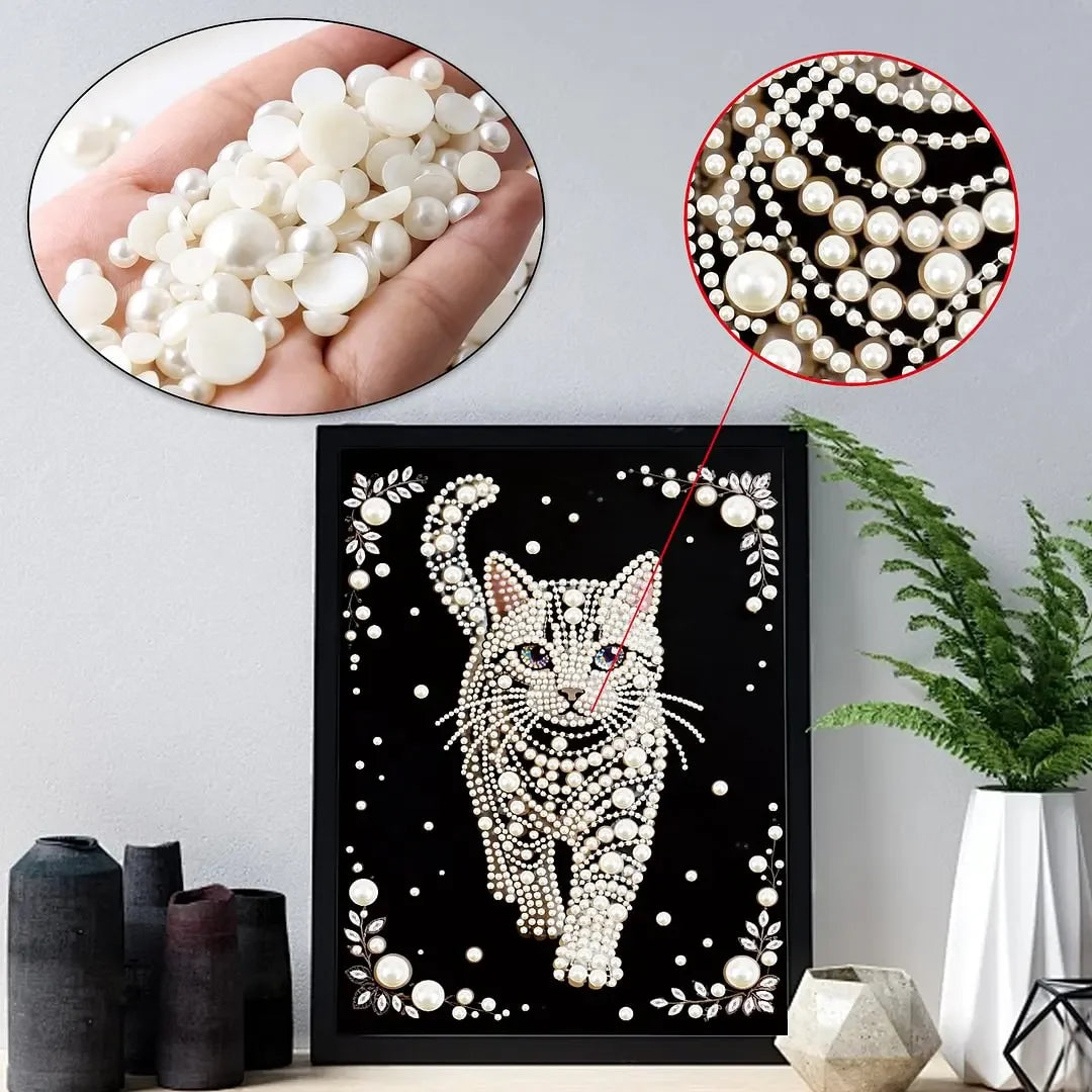 Diamond painting kit featuring a cat pattern with pearl accents and loose pearls.