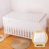 A white breathable mosquito net for baby cribs placed on a wooden floor.