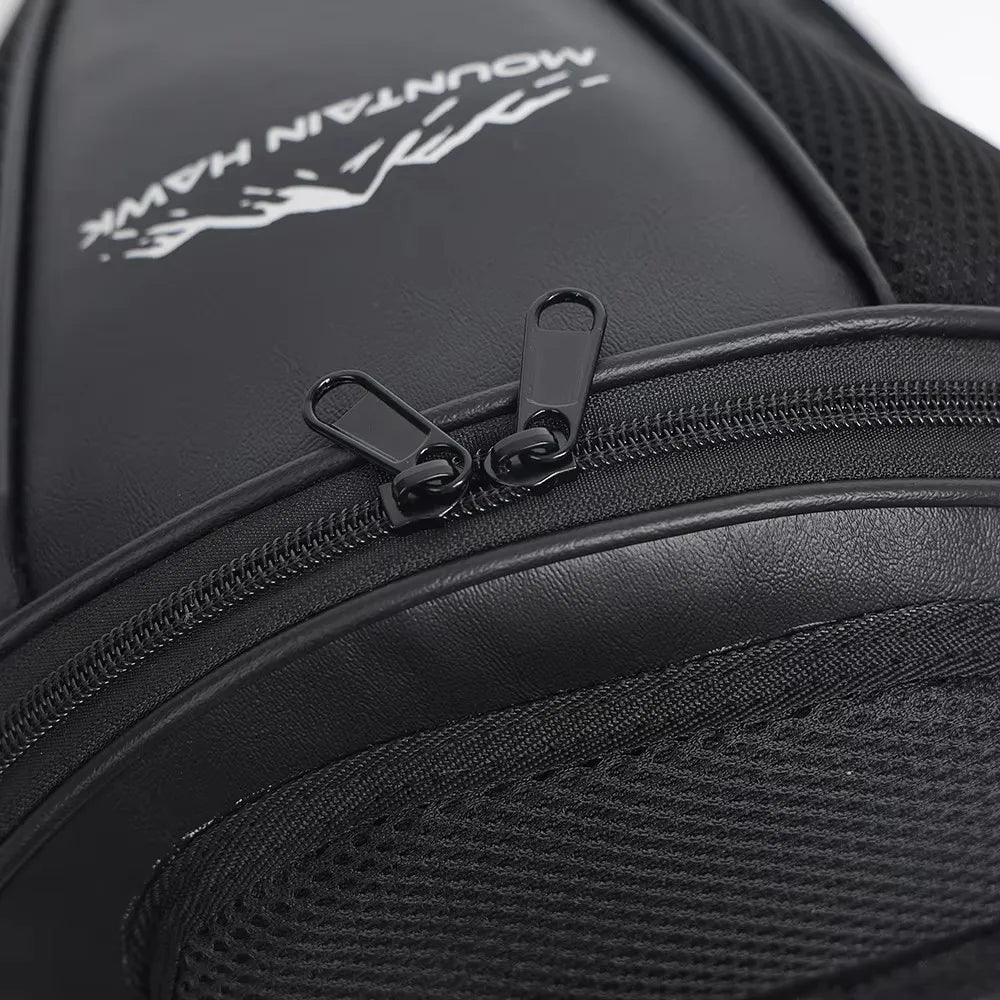 Black motorcycle tail bag with a zippered compartment and branding on the interior