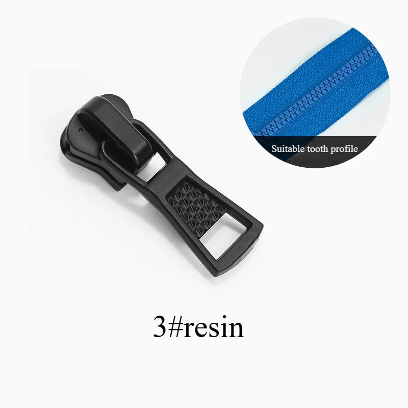 A black plastic zipper slider repair kit with a blue stitching detail is shown against a white background.