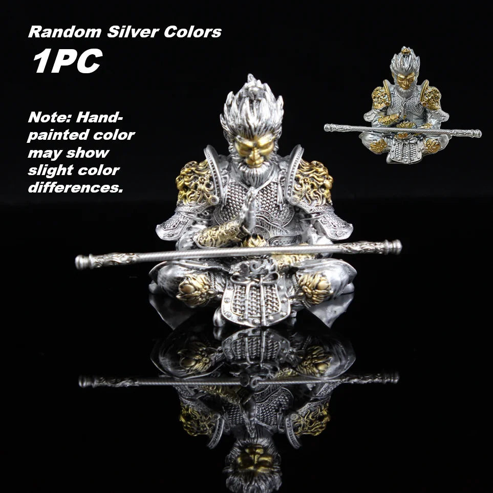Hand-painted silver colored monkey king figurine with staff shown against a black background.