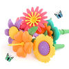 A collection of colorful plastic flowers and butterflies used in a STEM building toy set.