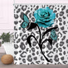 A floral design shower curtain featuring a blue rose and butterfly on a black and white leopard print background.