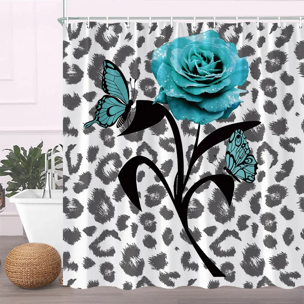 A floral design shower curtain featuring a blue rose and butterfly on a black and white leopard print background.