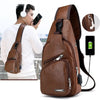 A brown men's crossbody sling bag is shown being worn by a man, with an inset showing the USB port.