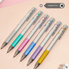 Ein Set farbenfroher Pilot Juice Up Gelstifte diagonal auf rosa Hintergrund