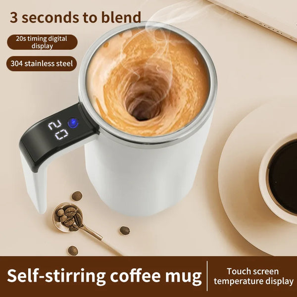 A white self-stirring coffee mug with a stainless steel lid and a digital temperature display is shown on a light background.