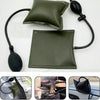 A dark olive green inflatable air wedge tool used for repairing car doors and windows.