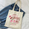 A canvas tote bag with a pink cherry print featuring the text Super Flavour Bubble Cherry New New