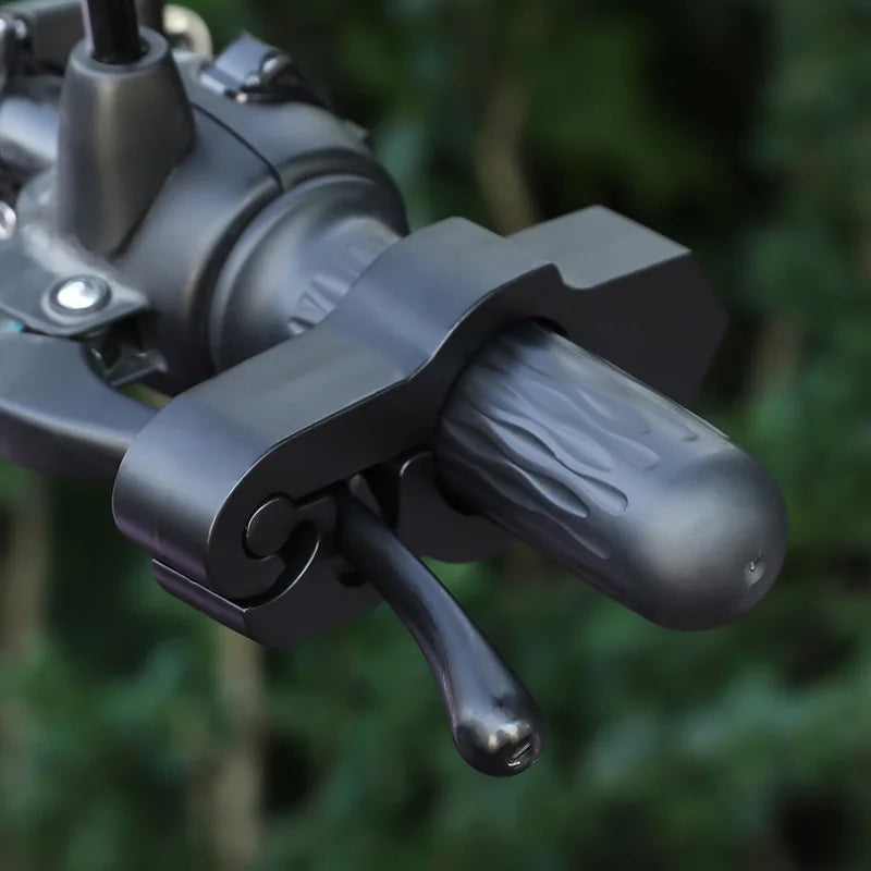 Close-up of a black motorcycle handlebar brake lock anti-theft security device.
