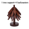 A wooden tree design set featuring one tree support and four leaf coasters.