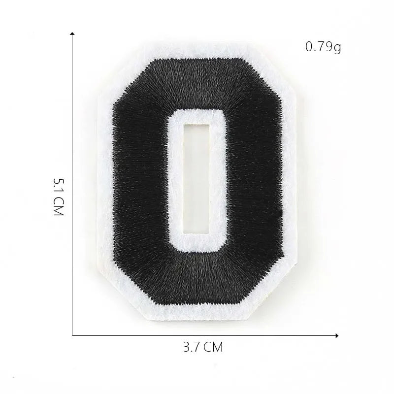 A black iron-on 3D number patch shaped like the digit zero, measuring 5.1 cm high and 3.7 cm wide.