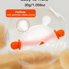 A clear silicone bunny-shaped baby teether with an orange handle is shown against a soft, fluffy background.