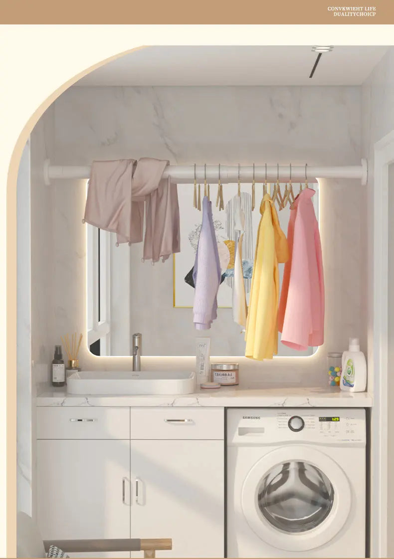 A bathroom interior showing a white vanity with a sink and a stainless steel tension shower curtain rod holding various color