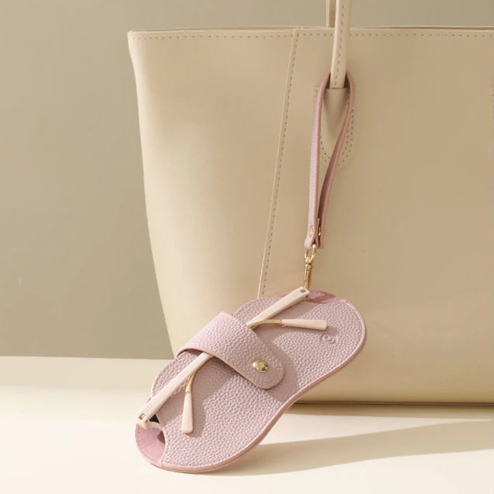 A light pink retro lychee pattern PU leather glasses case with a beige strap is shown against a neutral background.