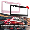 Black and pink rhinestone license plate frame with a bow design displayed over a red car.
