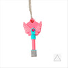 A set of four pink dagger key necklaces hanging from a silver chain.