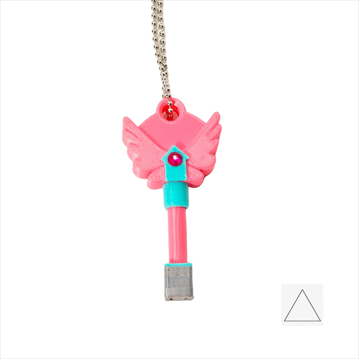 A set of four pink dagger key necklaces hanging from a silver chain.