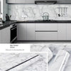 Close-up view of white marble contact paper showing the texture and adhesive quality on a surface.