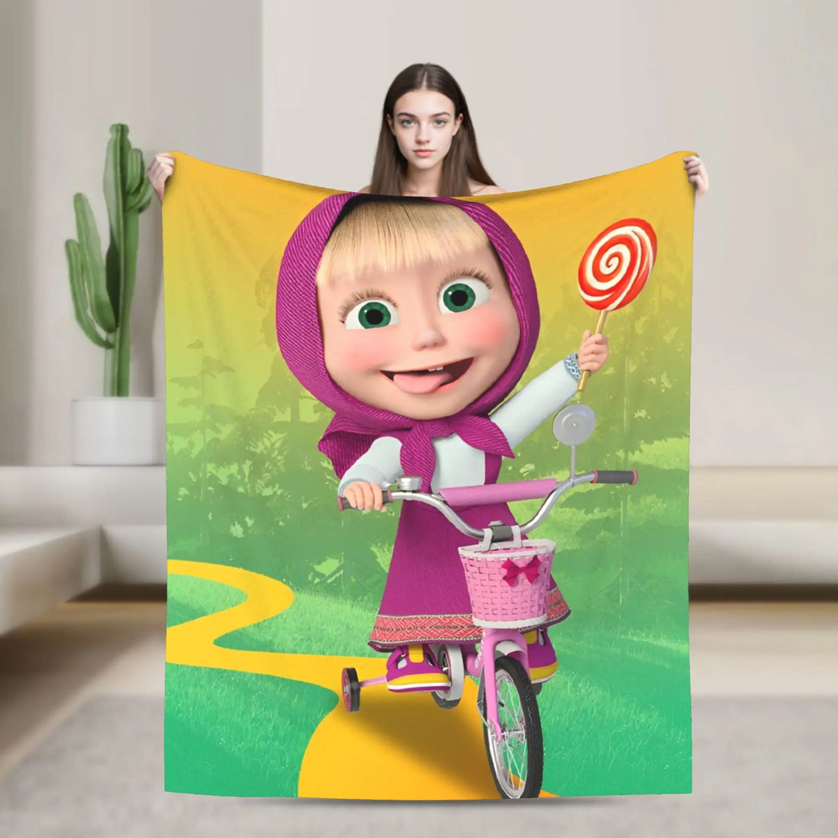 A colorful flannel throw blanket featuring a cartoon illustration of Masha and Bear.