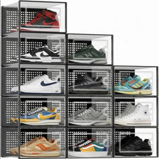 A grid of twelve clear plastic shoe storage boxes with front doors displaying various sneakers.
