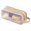 A clear mesh pencil case in beige fabric with a zipper, containing pencils and other school supplies.