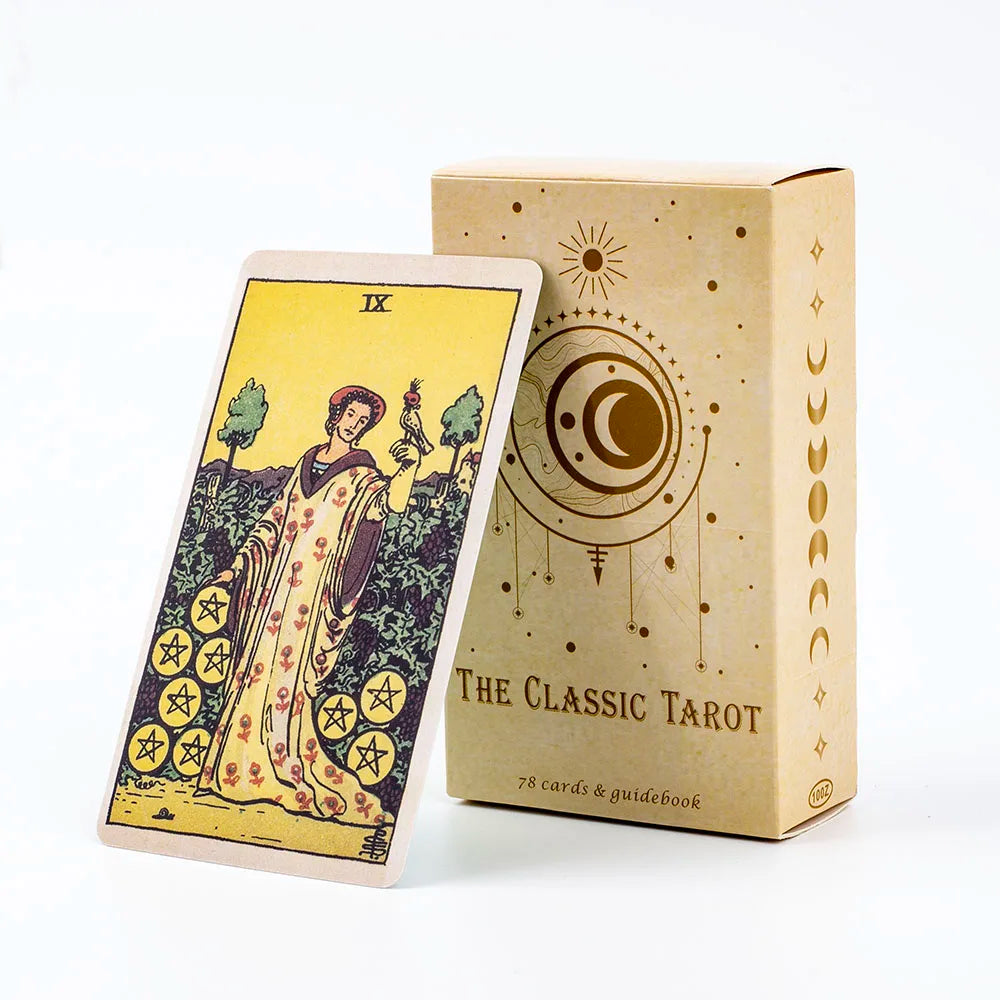 A deck of tarot cards and guidebook in a light brown box with gold accents.