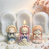 A set of three silicone molds shaped like praying girls for candles, soap, and craft decor