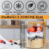 A clear glass jar filled with breakfast cereal and fruit, sealed with a bamboo lid and spoon.