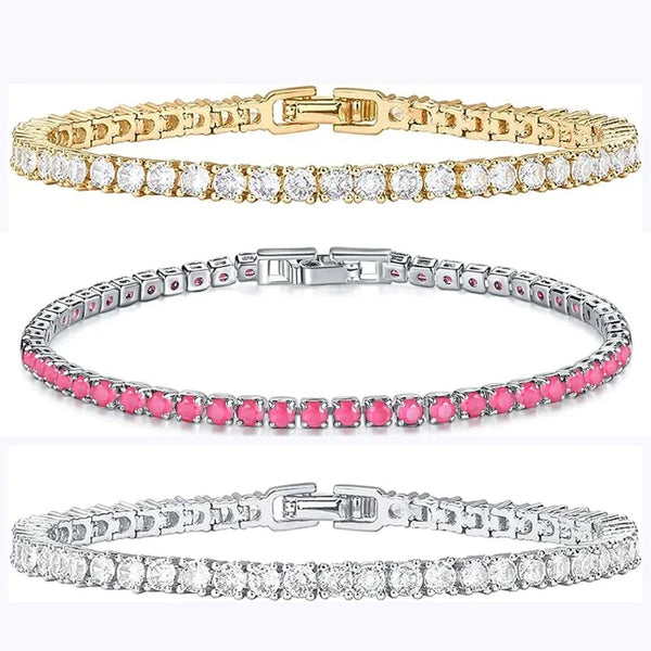 Drei Tennisarmreifen mit Zirkonia-Steinen in Gold-, Pink- und Silbertönen.