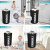 Black collapsible laundry baskets used for organizing clothes in a bathroom and baby room.