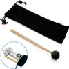 A black weighted tuning fork is shown next to a wooden mallet, illustrating the sound healing tool.