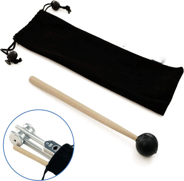 A black weighted tuning fork is shown next to a wooden mallet, illustrating the sound healing tool.