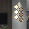Moroccan-inspired decorative mirror wall stickers featuring gold-edged, ornate mirrors on a gray wall.