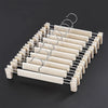 A rack of space-saving adjustable clip hangers designed for hanging pants, skirts, and trousers.