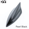 A sleek, black shark fin car antenna painted in pearl black.