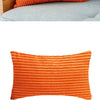 Orange corduroy cushion covers with vertical stripes