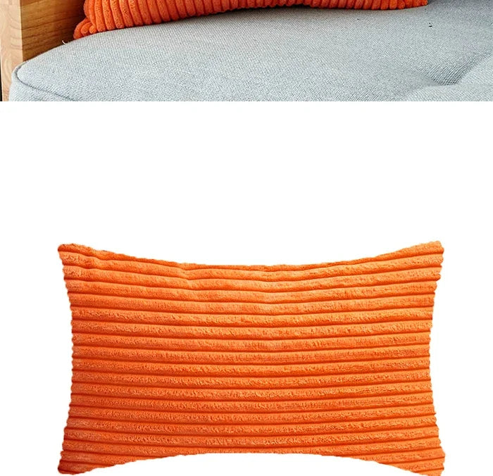 Orange corduroy cushion covers with vertical stripes