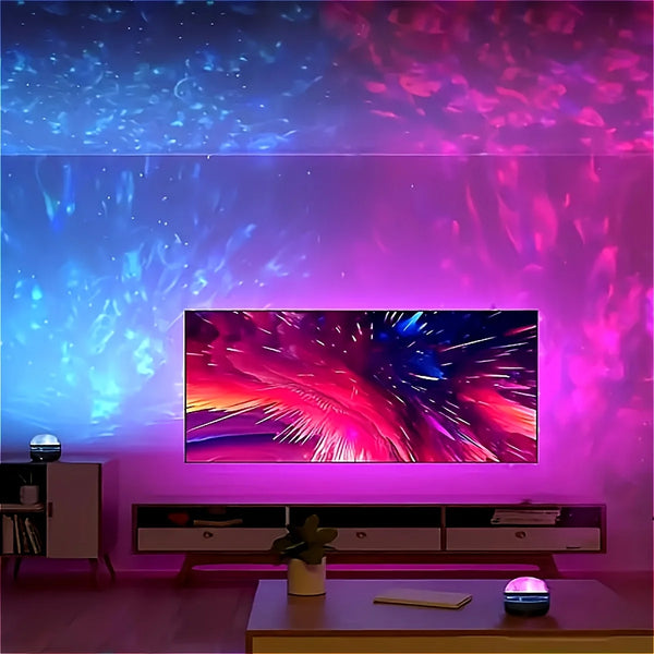 A modern room features a large screen displaying vibrant pink and blue light patterns, with a projector on a table.